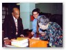 Mario Gonz&aacute;lez, Library Director, assisting the legendary Pura Belpr&eacute; as she signs copies of her book at an outreach event to English-as-a-Second Language patrons at the New York Public Library.
